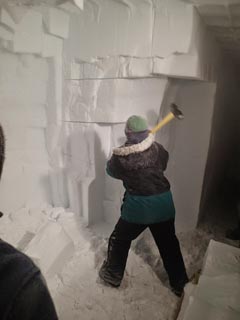 hammering away at the ice tunnel walls