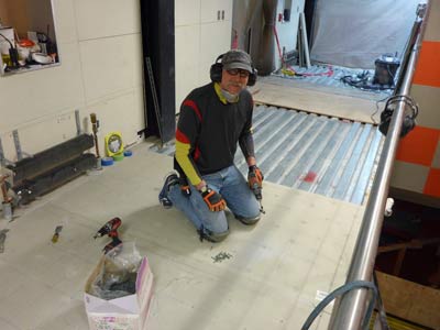 Mike Rice screwing down the subfloor