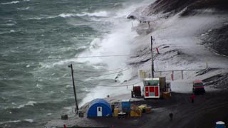 waves crashing against Hut Point