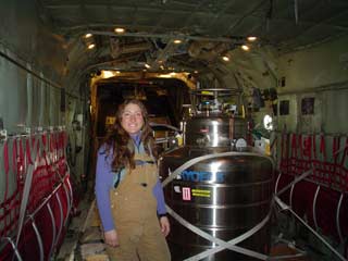 Christina with a helium dewar on an LC-130