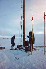 muon detectors being lowered into the Greenland icecap