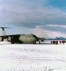 first C-141 to land at Pegasus