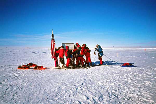 the ski group in front of the South Pole sign