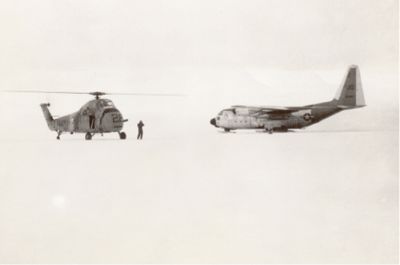 helicopter standing by in case of emergency as the LC-130 lands