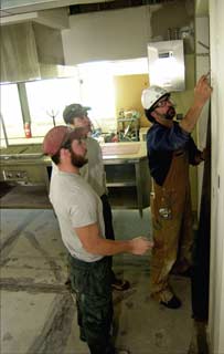 carpenters at work in the kitchen area