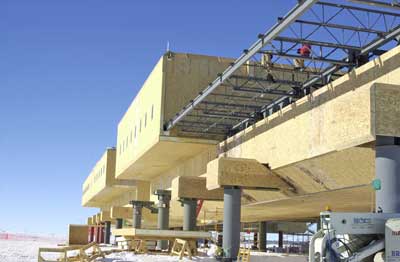 Tom Pi and Adam Rein installing angle bracing on floor trusses