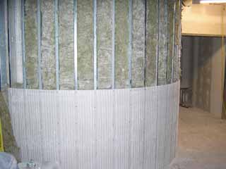measure twice, measure again, cut...no, measure again and cut closeup of curved sheetrock installation