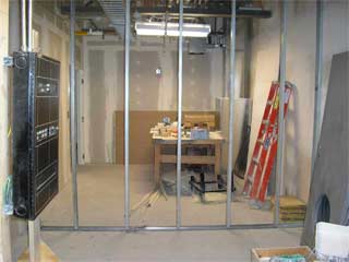 wall between the B3 coatroom and store storage