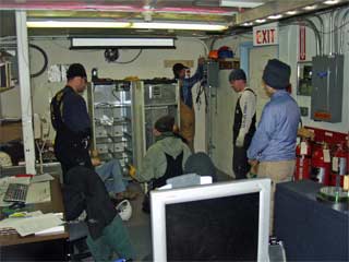 removing the new station UPS from its borrowed location in dome comms