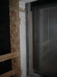 the left outside first floor door jamb