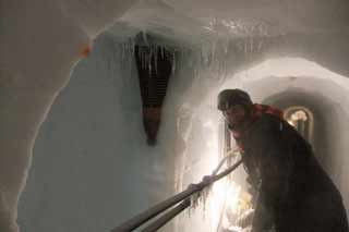 the firn drill penetrating into the tunnel