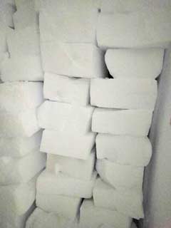 sled full of cut snow blocks