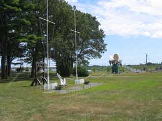 we build, we fight looking toward the large Seabee statue that used to be at the main gate