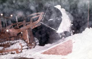 dumping snow in the snow melter