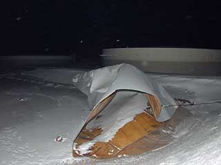the tank roof rolled up like a taco