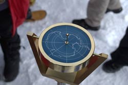 front of the South Pole marker