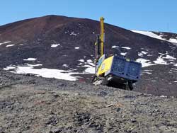 rock drill at work on the earth station site