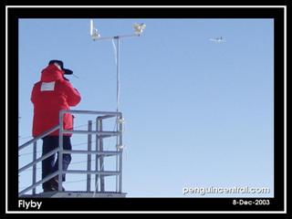 Jon Johanson flying over the South Pole as Nick Tothill watches