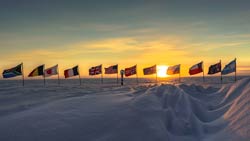 the sun setting behind the ceremonial pole
