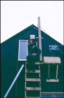 coming down Jack Cummings emerging from the Palmer radio room aka the attic of BAS Base N
