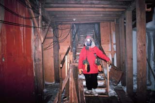 at the bottom of the holy stairs next to comms