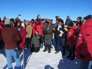 crowd watching the Pole marker ceremony