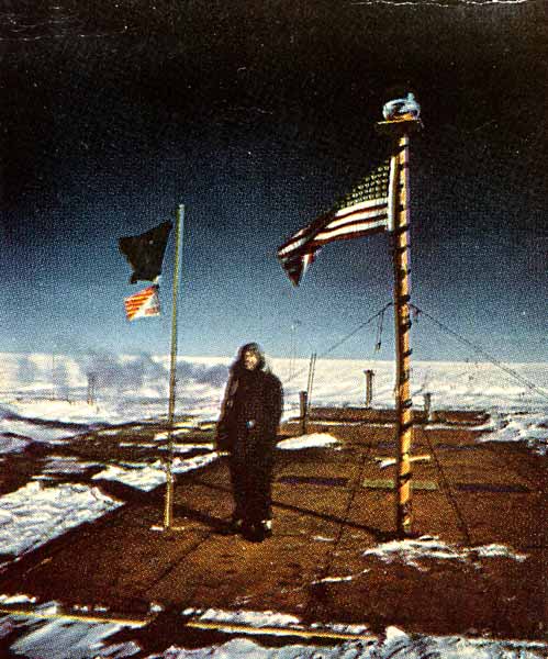 Paul Siple on the garage roof next to the flagpole