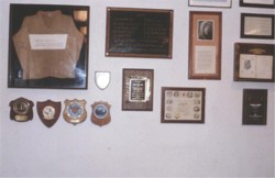 the plaque and other items on the pool room wall in 1980
