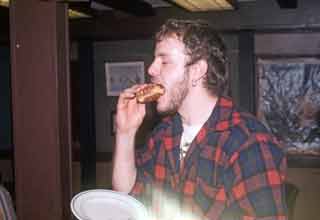 Lloyd eating a burger
